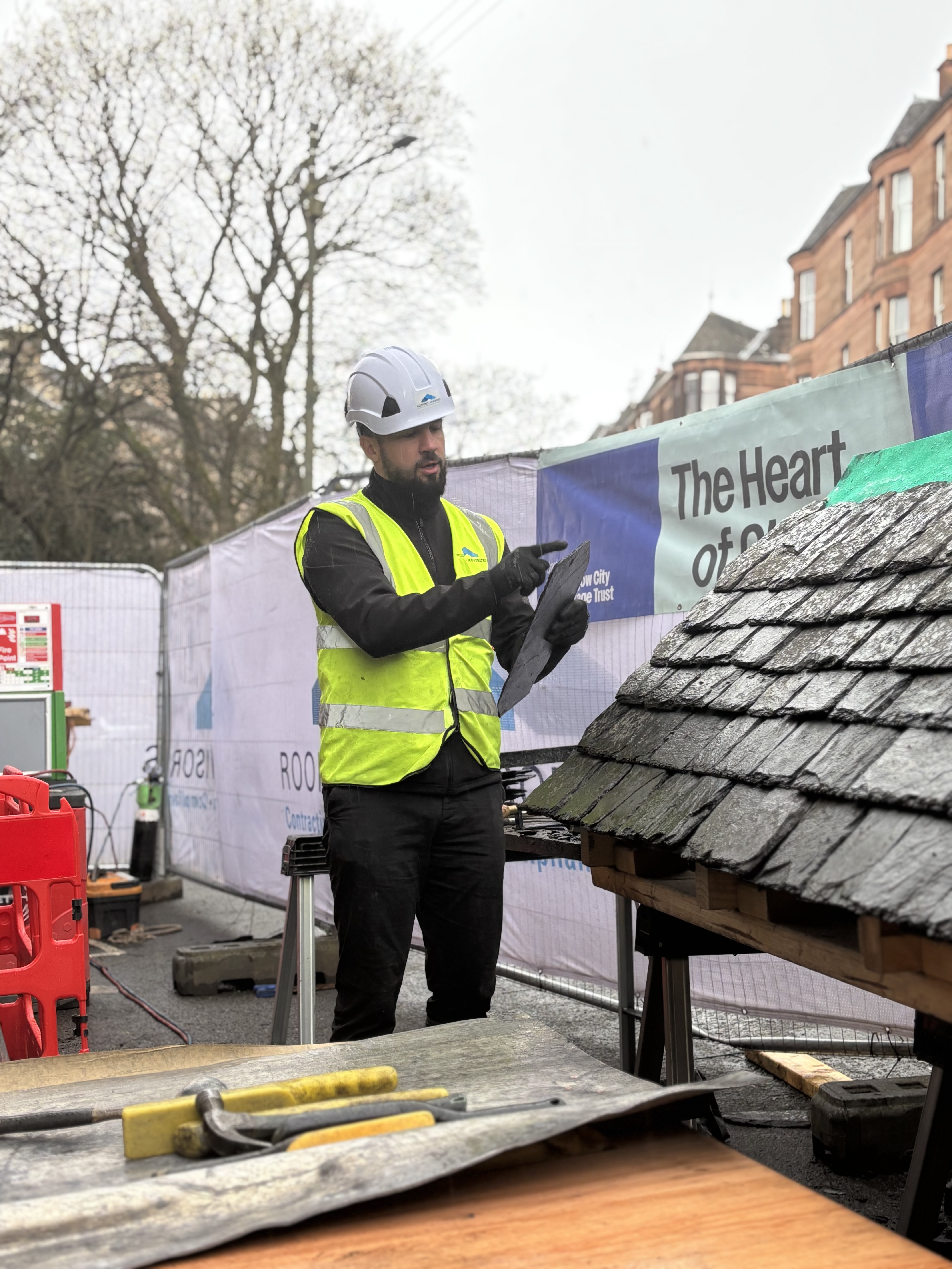 Traditional slating demonstration at the Wilton Street heritage roofing demo day, hosted by Roofing Advisors in partnership with Glasgow City Heritage Trust