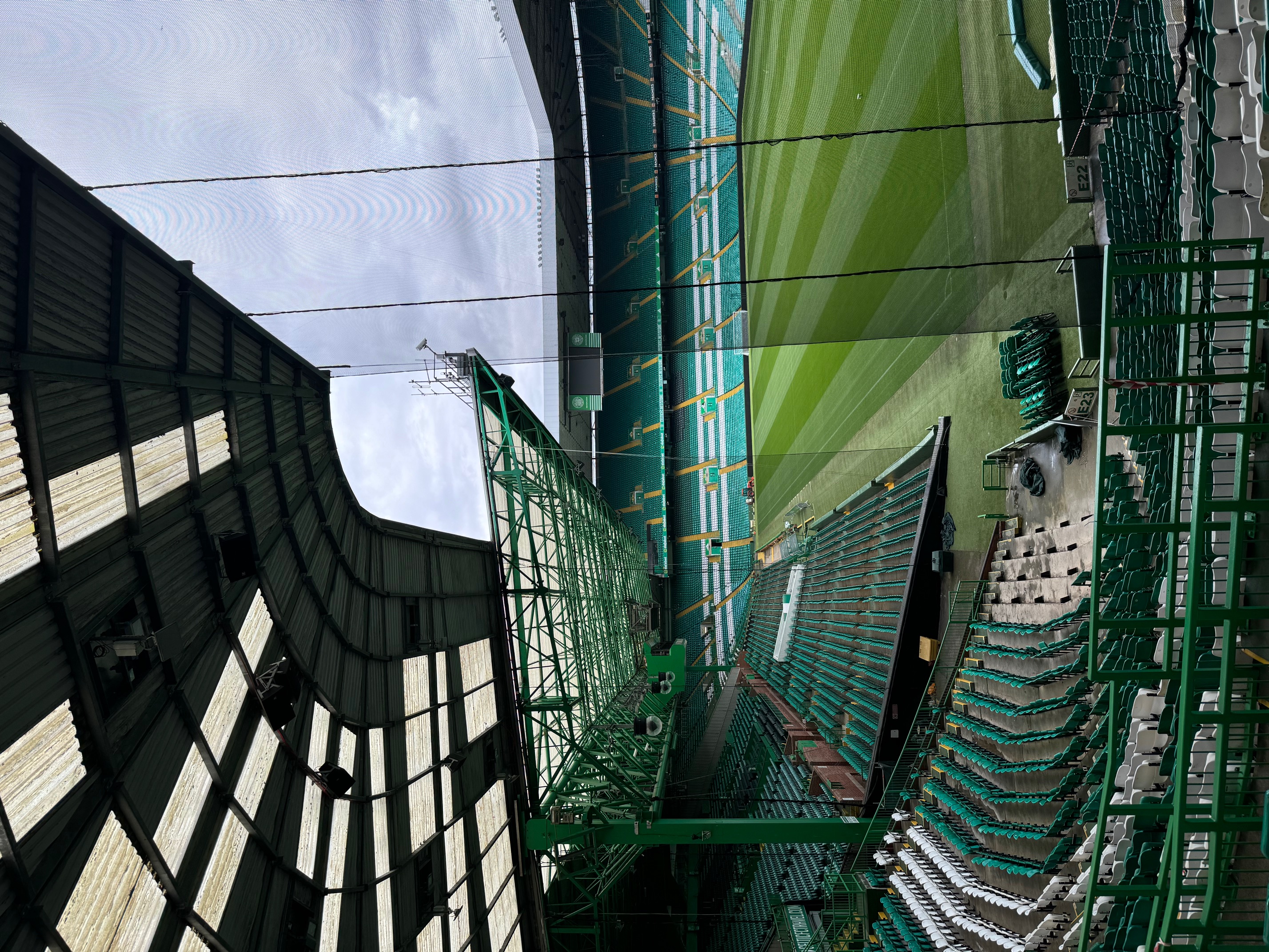 Bespoke segregation netting installed by Roofing Advisors rope access team inside Celtic Park, Glasgow, dividing fan sections ahead of a fixture