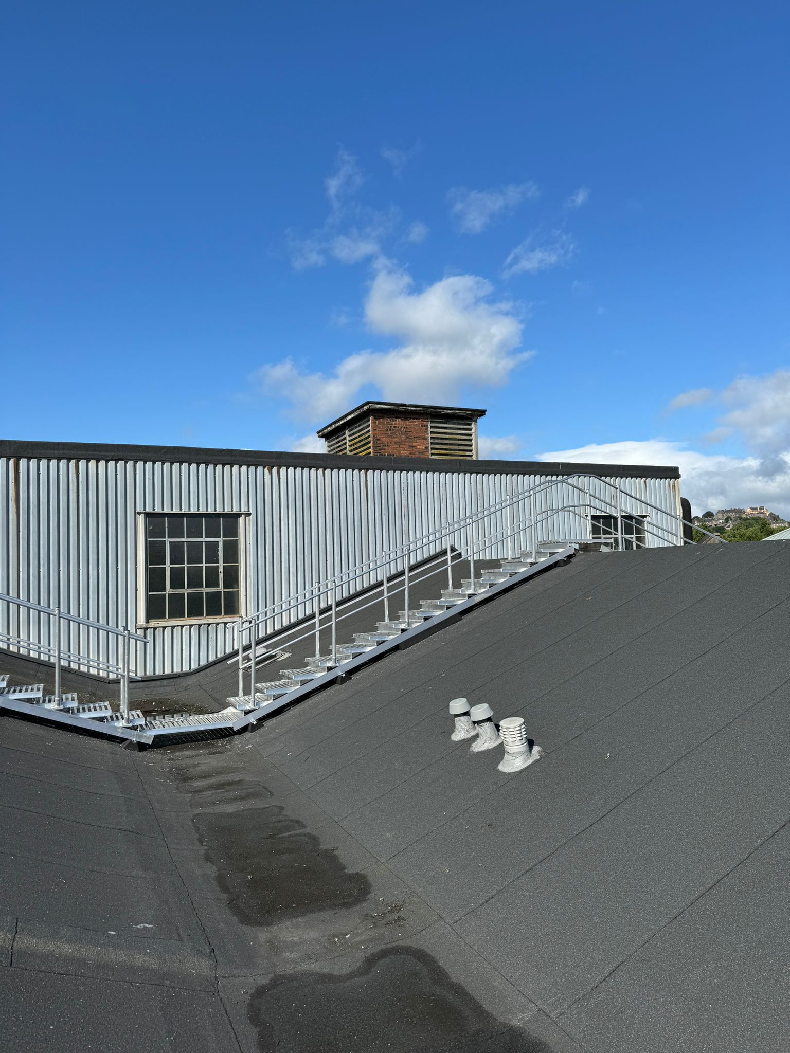 Ascent Safety Fabrications walkway and step units installed along a roof slope at Stirling Enterprise Park, providing safe maintenance access