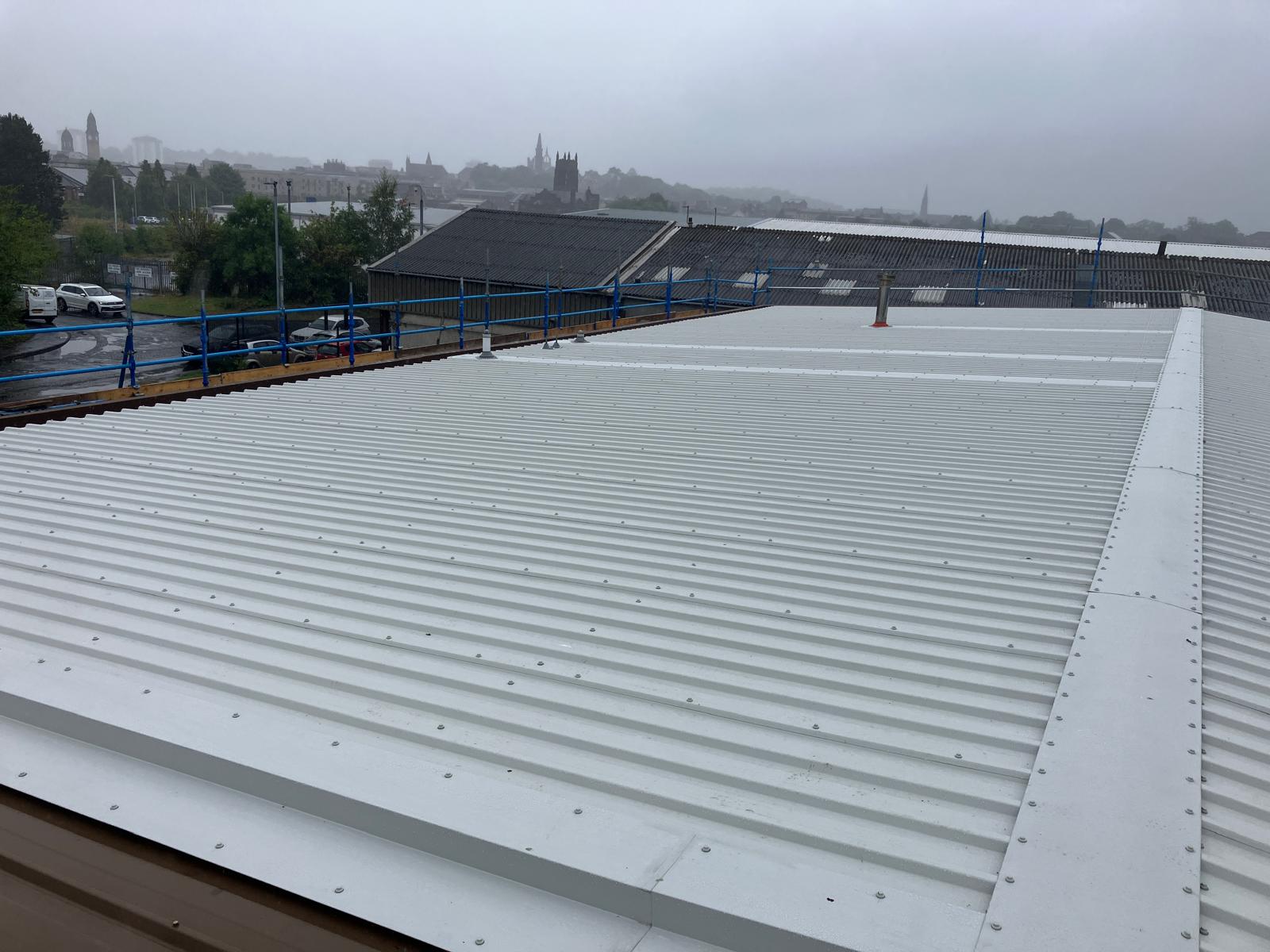 New AS30/1000 roof sheeting with overclad rooflight and dektite flashing detail at Wallneuk Road, Paisley