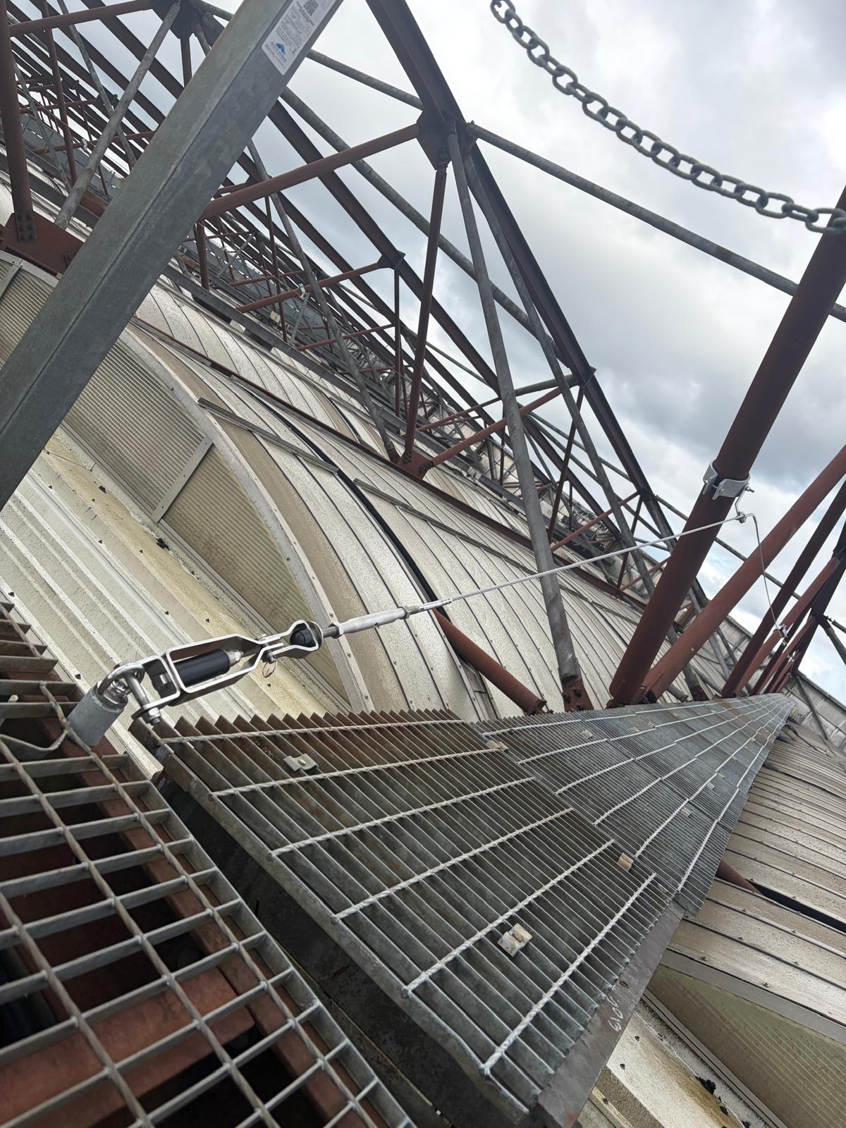 New fall protection system with cable anchorage points and walkway installed on the roof at Hampden Park, Glasgow