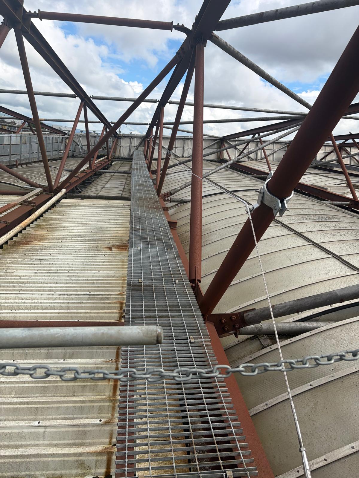 Fall protection cable system and chequer plate walkway installed along the roof structure at Hampden Park, Glasgow