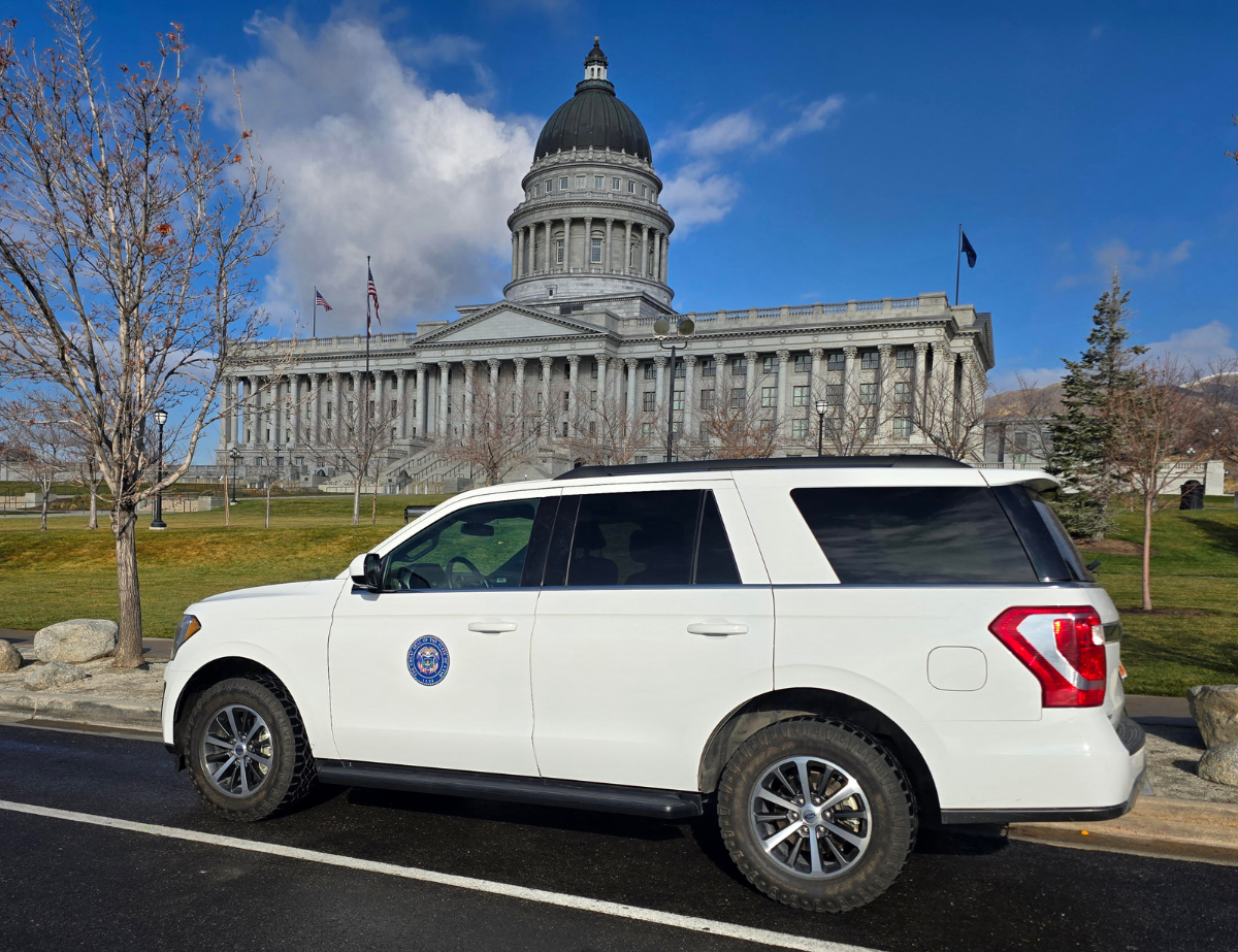 Utah Land Trust's white vehicle by the State Capitol building.