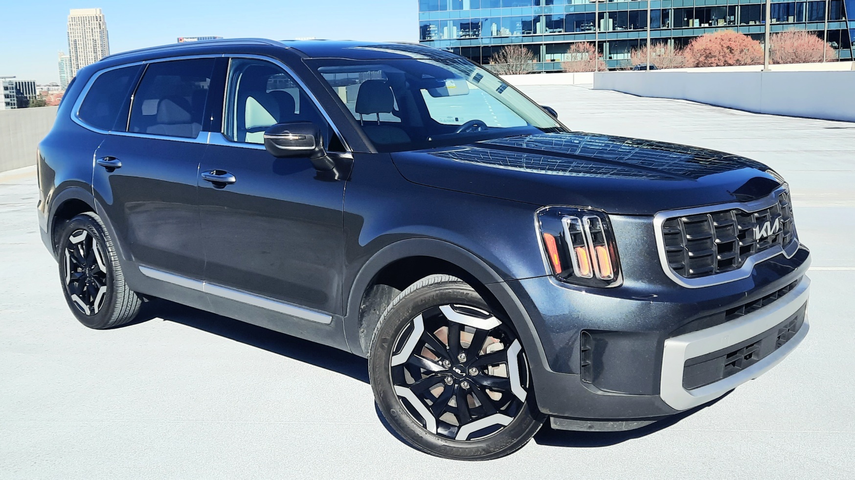 Georgia Department of Economic Development shows a clean Kia on a rooftop parking deck.
