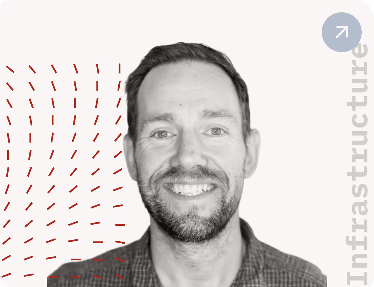 Smiling man with short hair and beard, wearing a checkered shirt, on a light background with red dashes and 'Infrastructure' text.