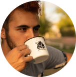 a guy drinks coffee