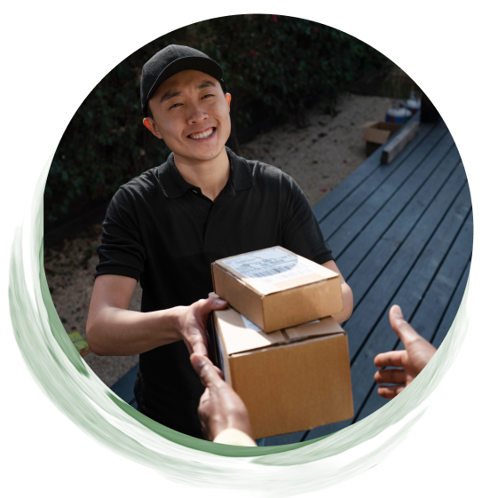 a guy smiling and holding packages