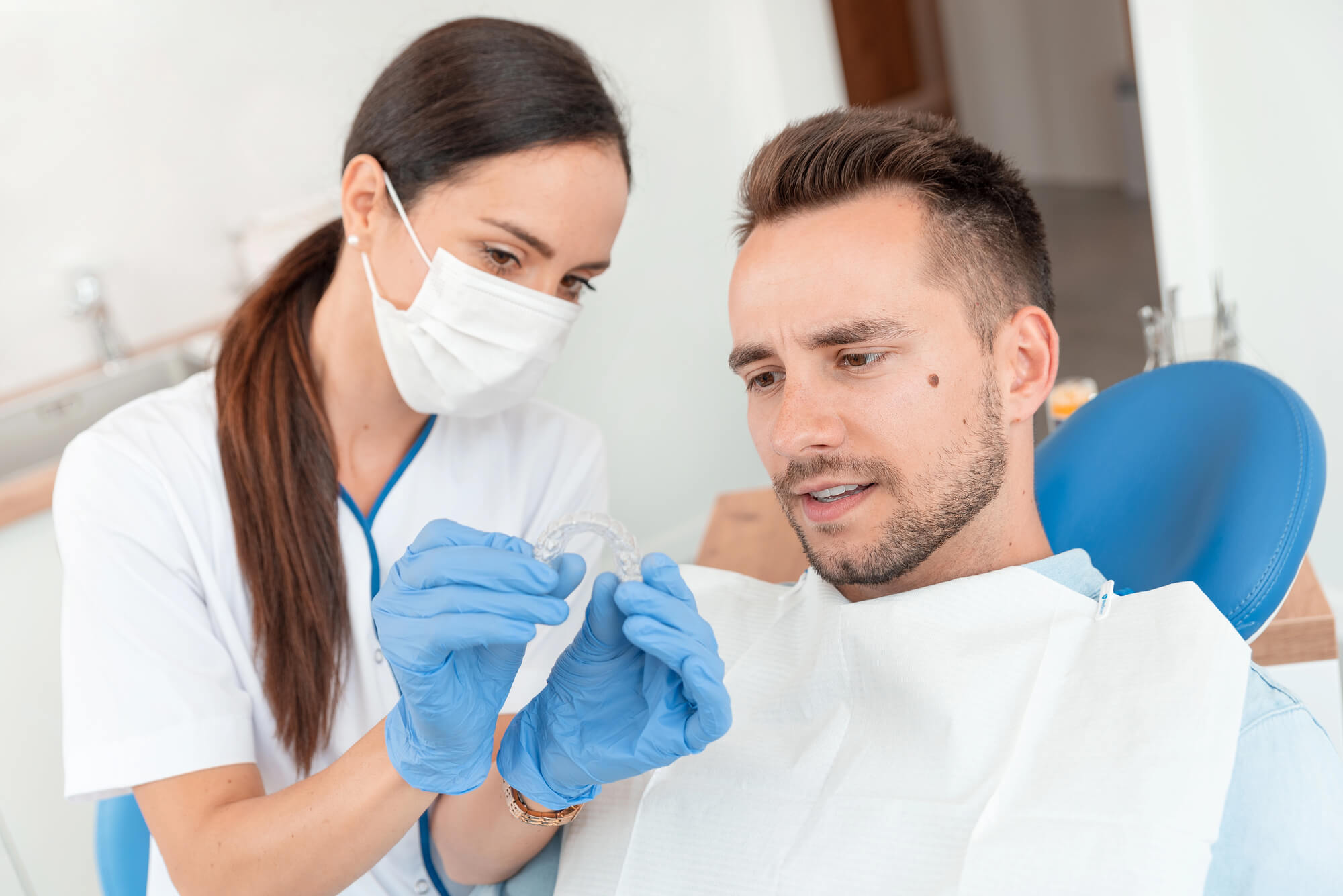 dentist discussing Invisalign in Fort Worth TX