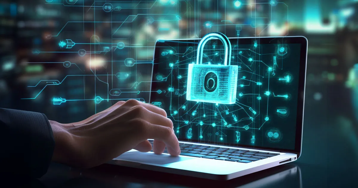 A hand is typing on a laptop with a green security lock on the screen.