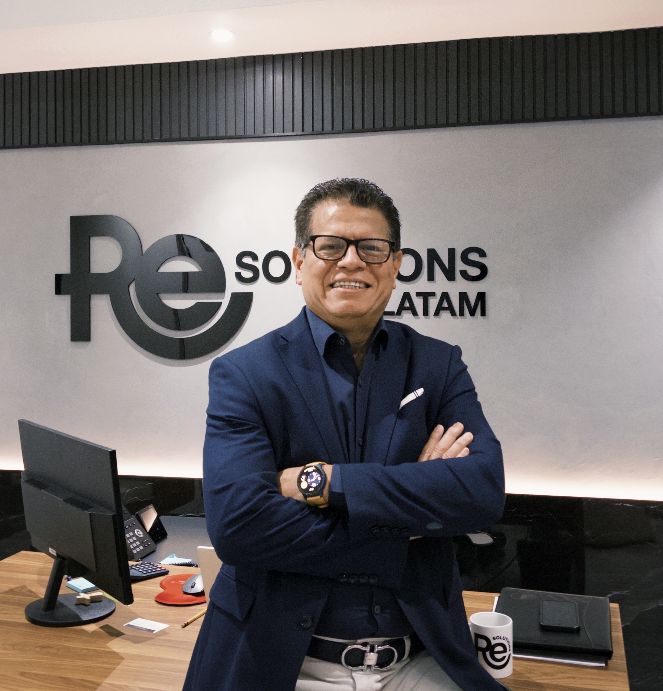 Mr. Jose Contreras sitting on his desk at his office