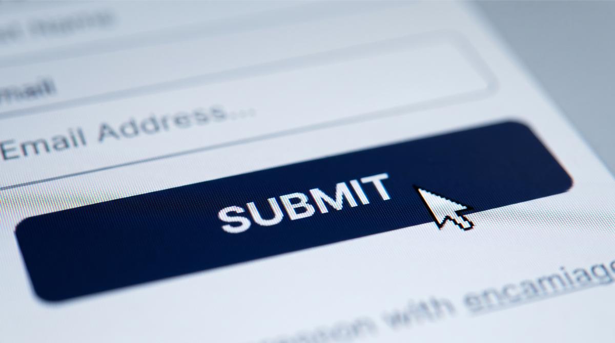 a cursor icon hovering over a single button on a webpage, shallow depth of field