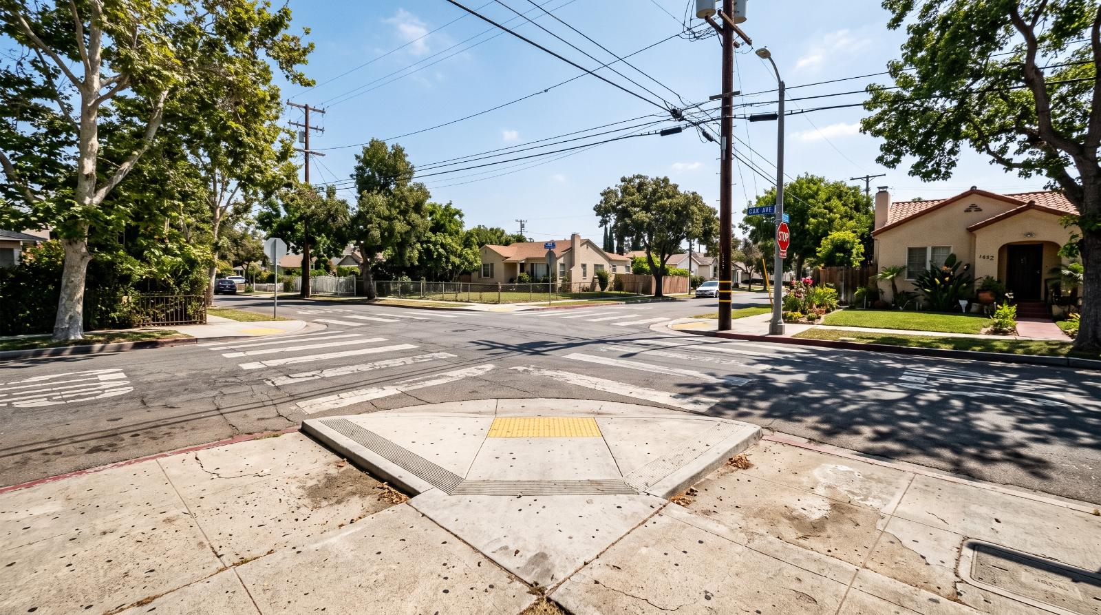 a California sidewalk curb ramp for wheelchair access at a residential street corner