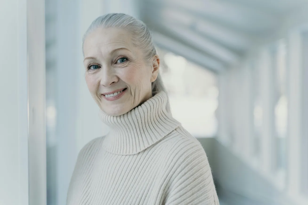 Women with grey hair smiling
