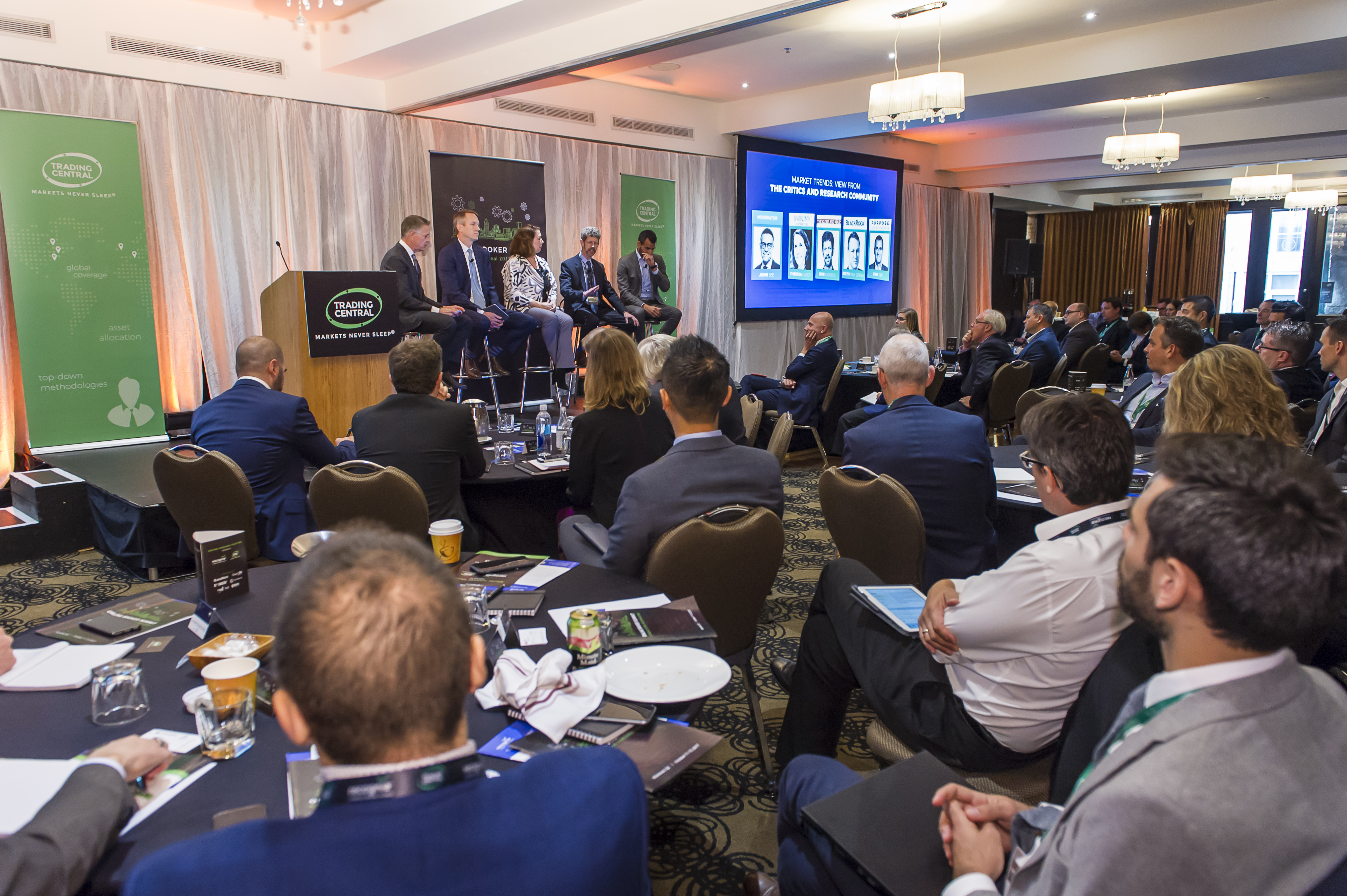 Professional shot through the audience of the 2017 market trends panel