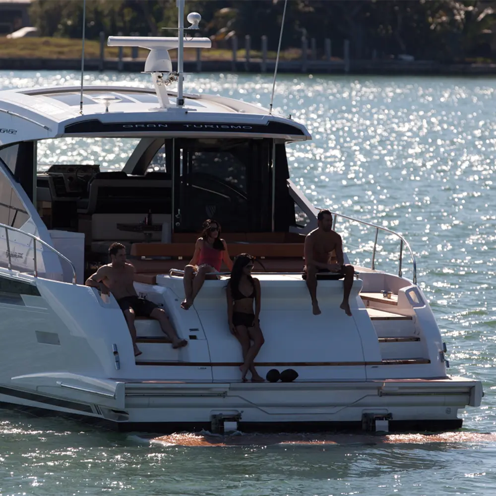 Superyacht stern with hydraulic platform in lowered position at waterline