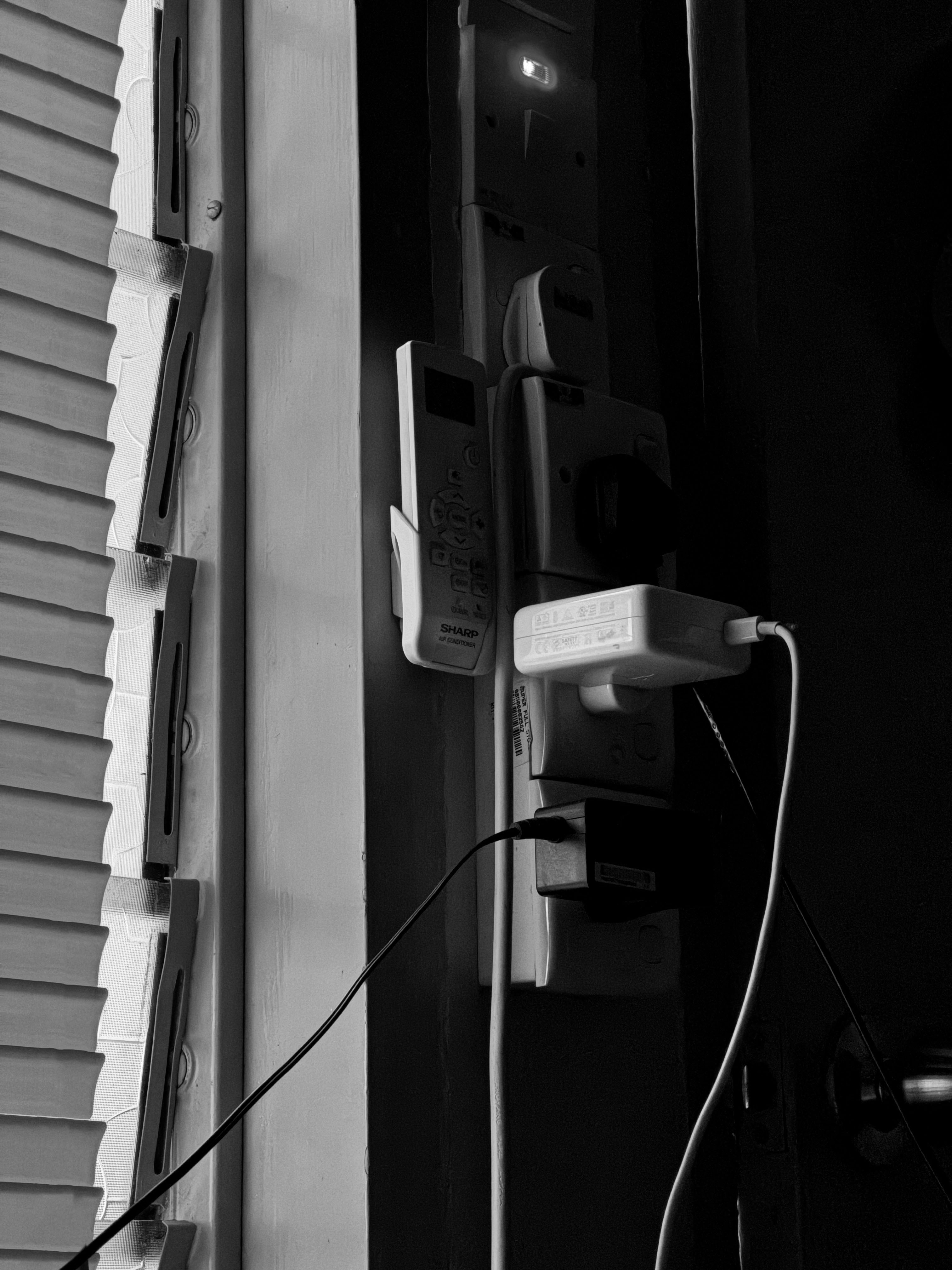 A telephone is plugged in to a wall