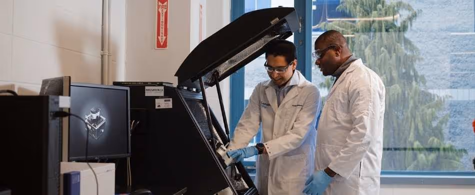 Industrial workers using equipment