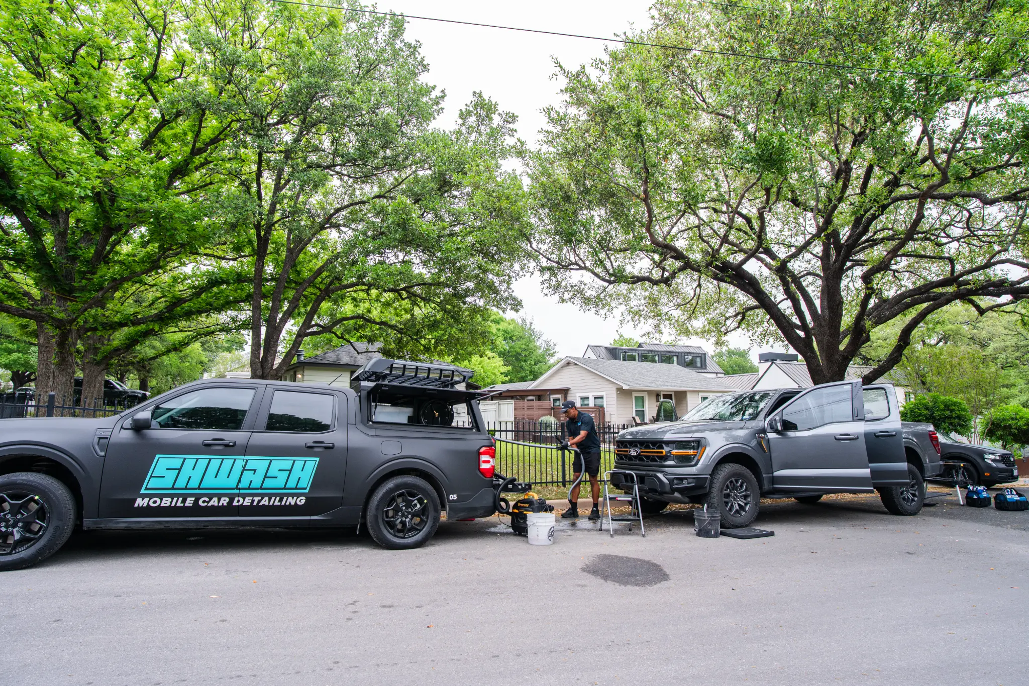 SHWASH mobile car detailing truck servicing a vehicle in Austin TX