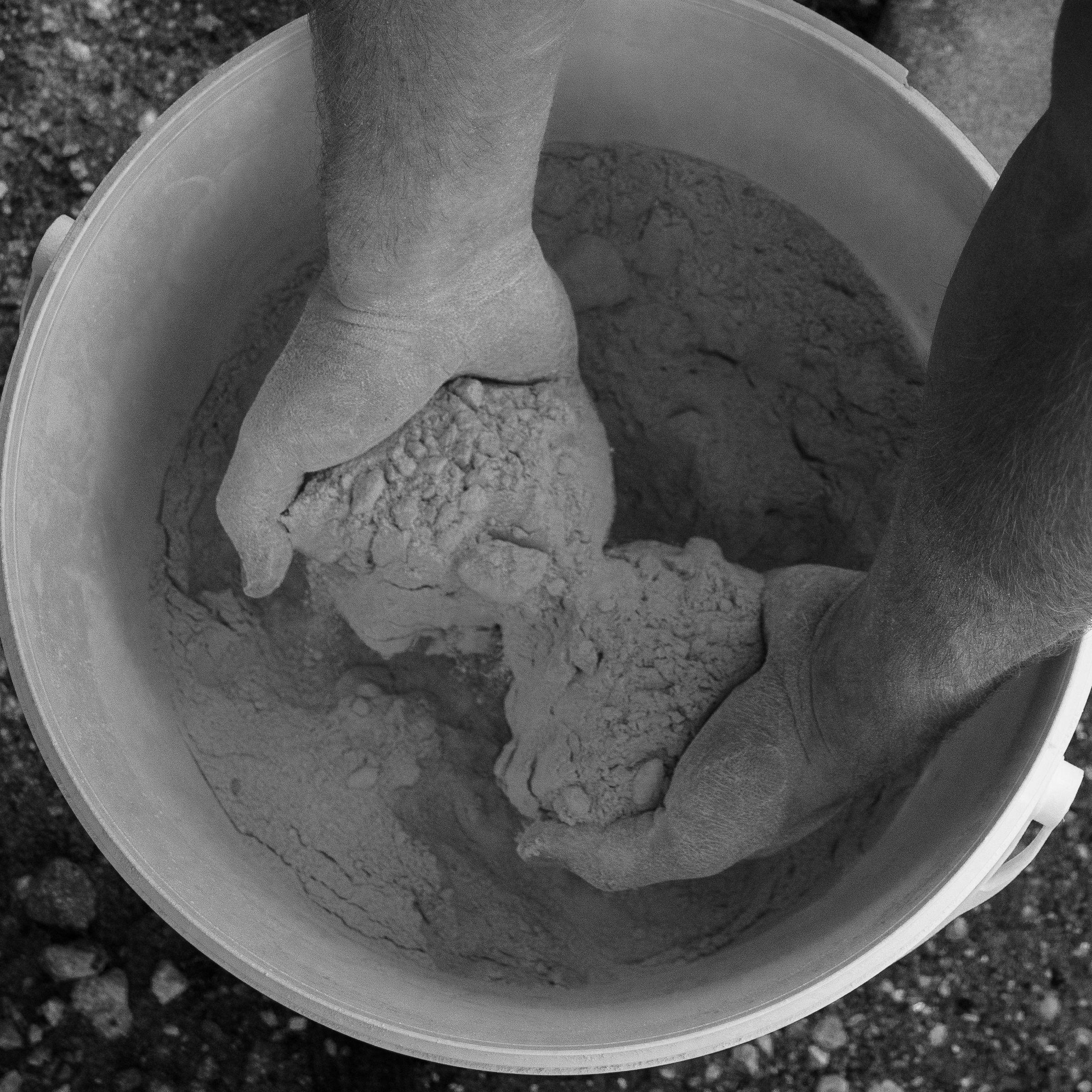A picture of hands running through the product that is being used to treat the furniture