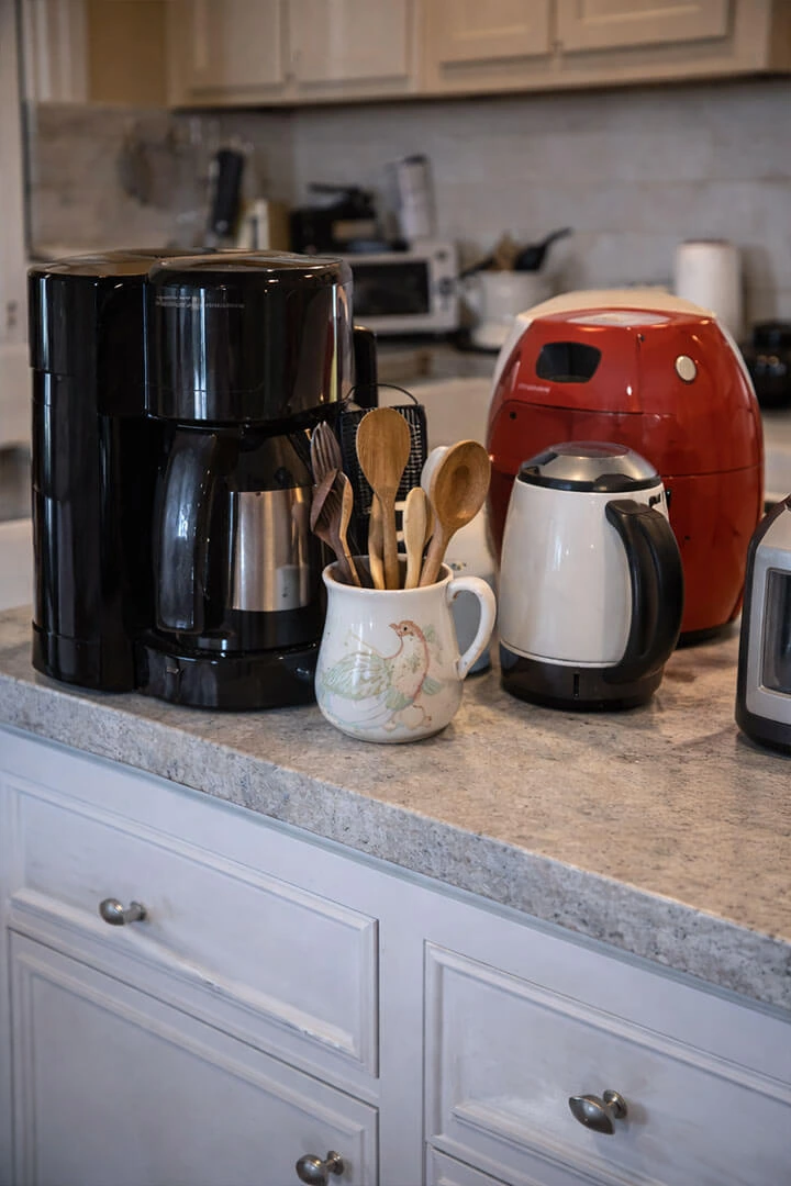 Cluttered kitchen countertop essentials