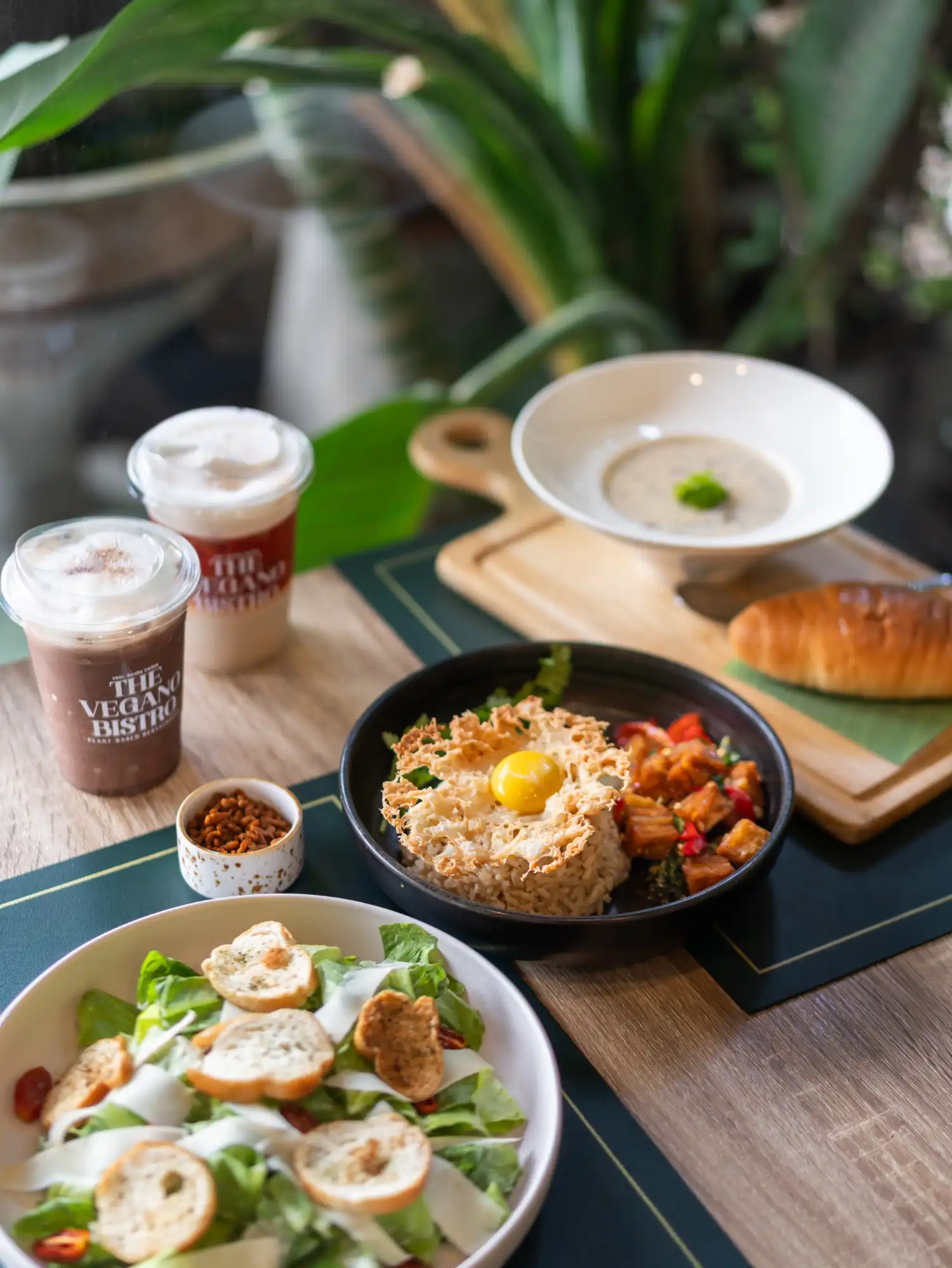 Stylized cafe photography featuring vegan soup and pastry for menu and instagram content
