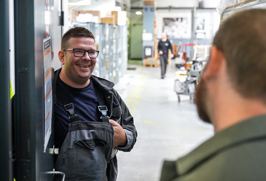 Two men talking in the warehouse