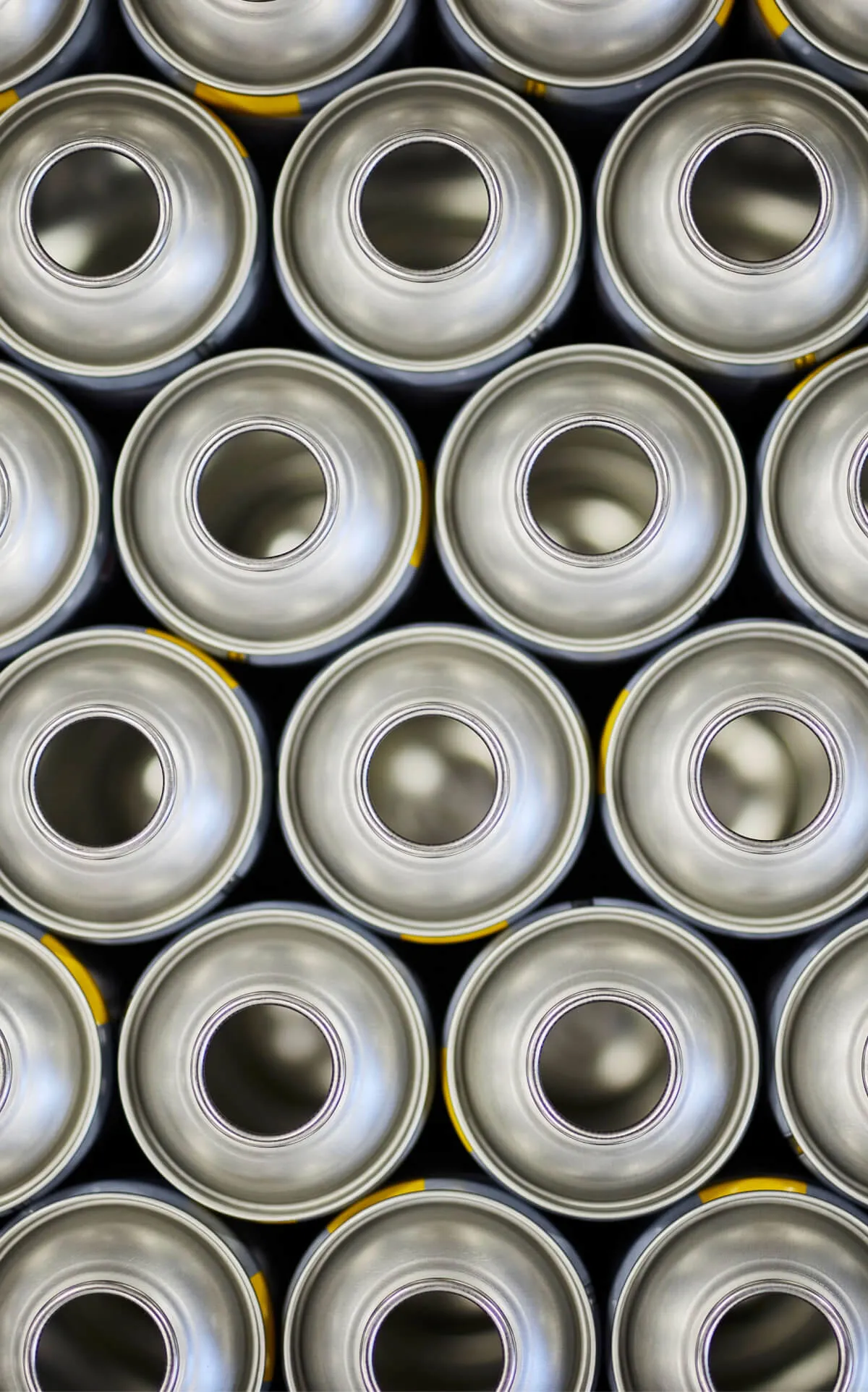 A lot of empty aerosol cans seen from above