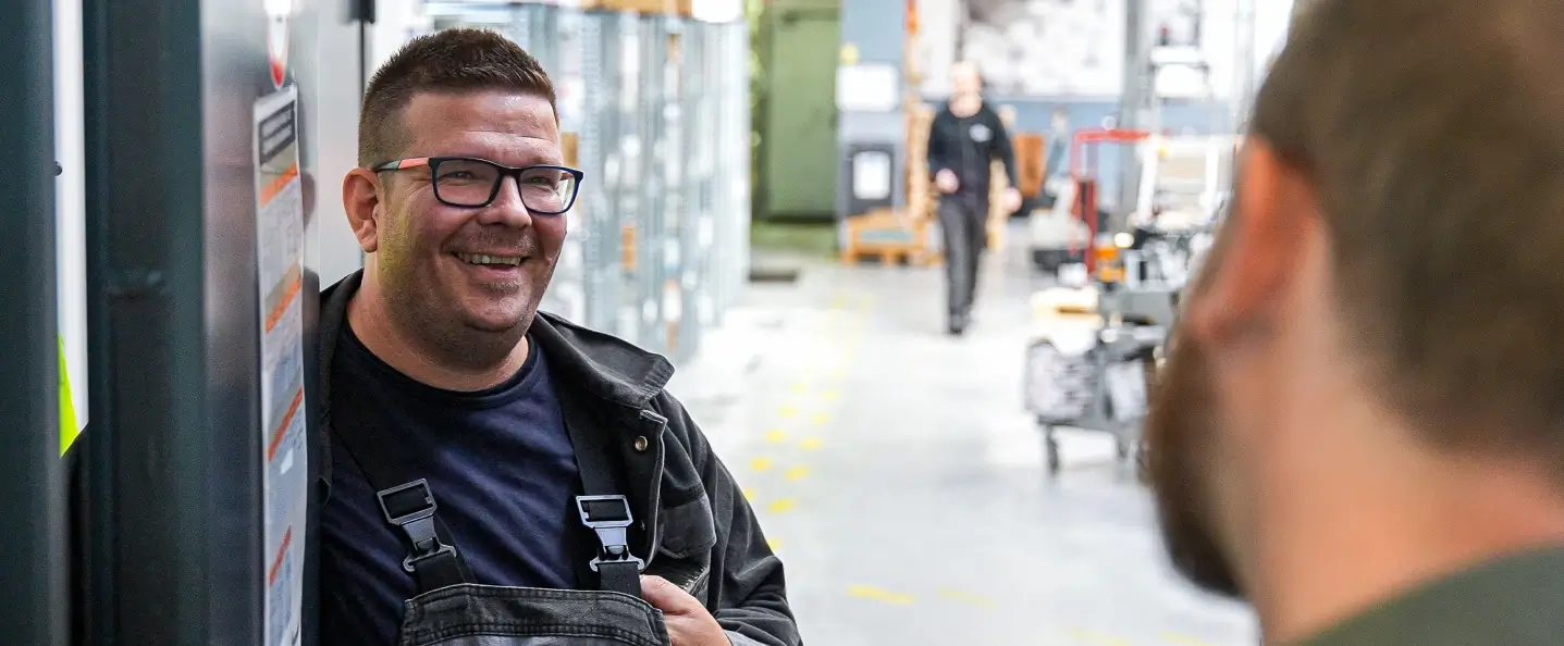 Two men talking in the warehouse