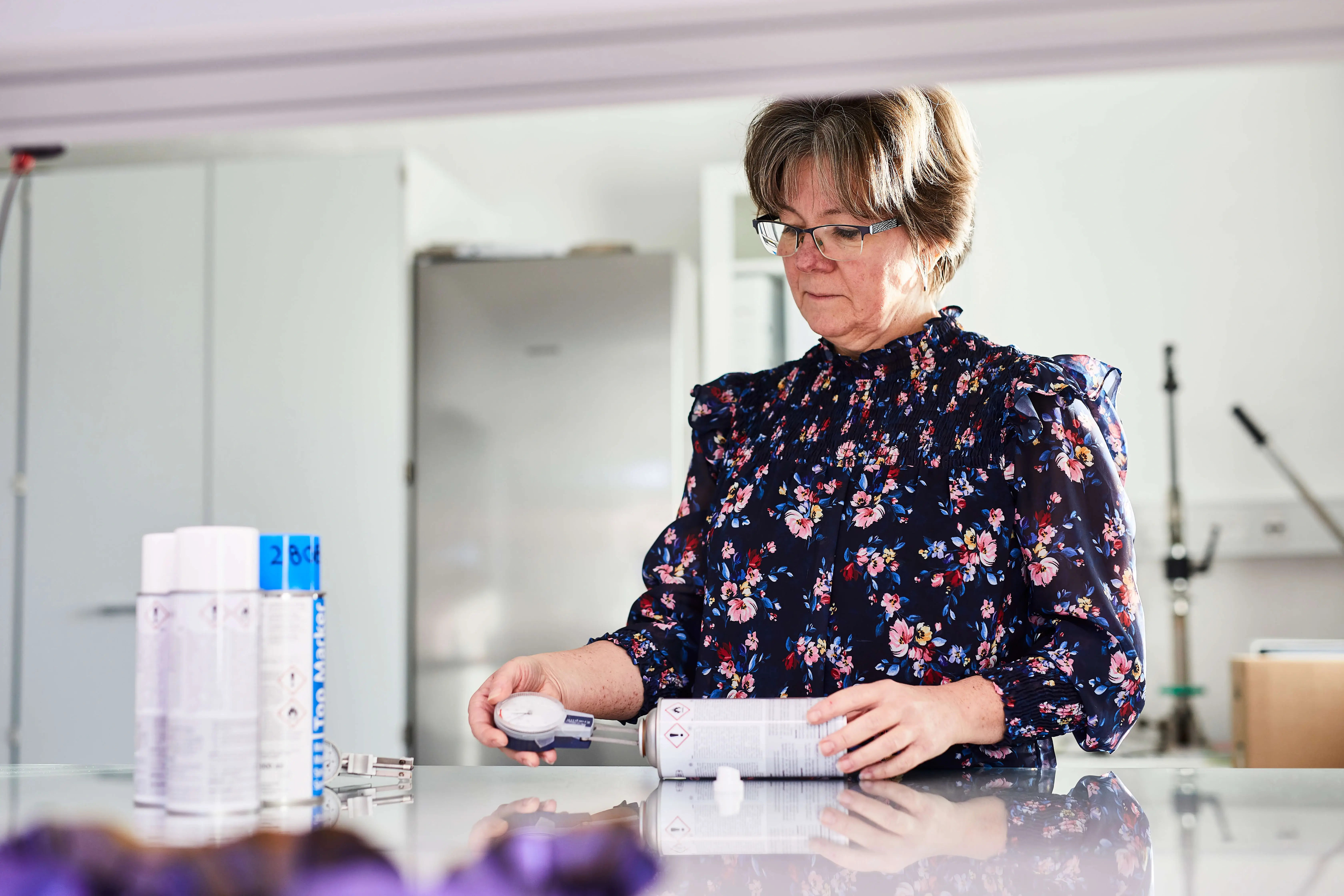 A woman standing at a desk