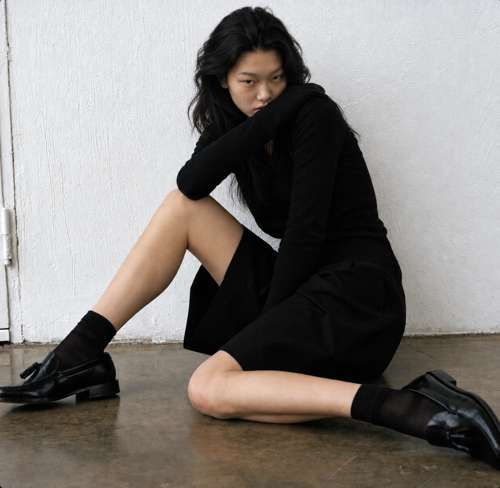 A flat lay of a jacket beside the same jacket photographed on an AI generated model