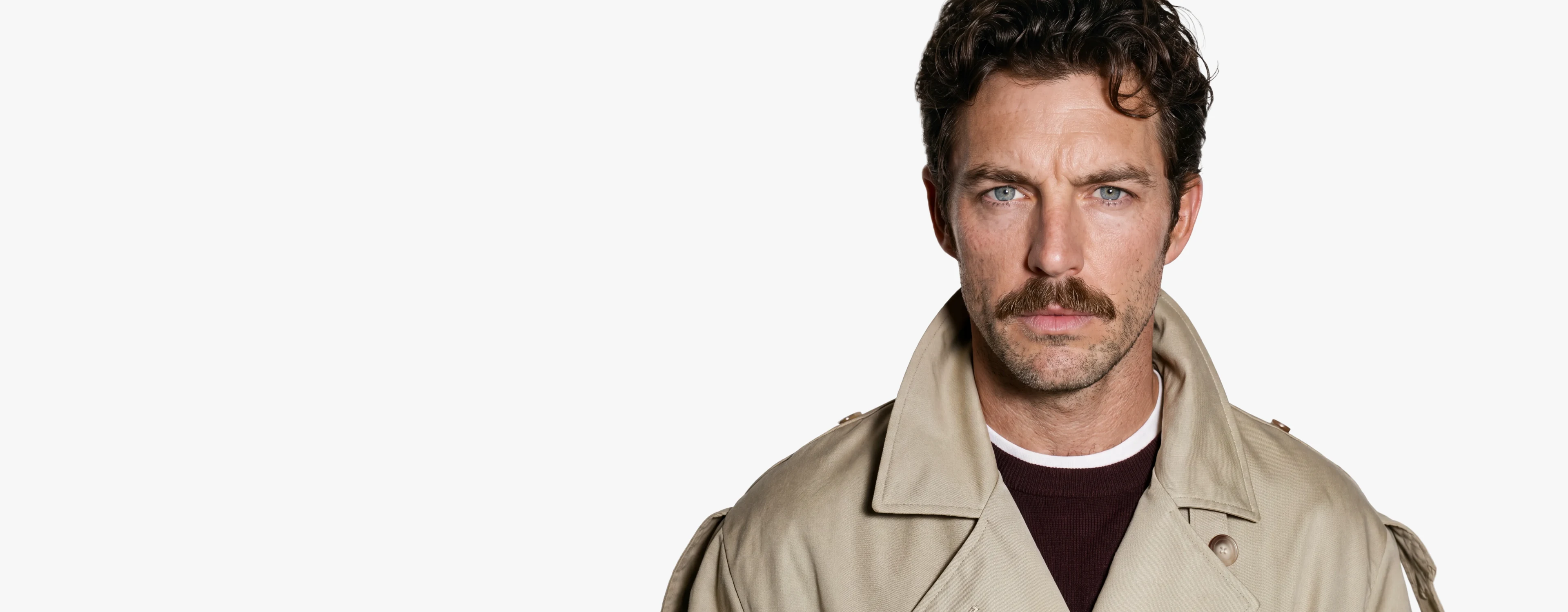 AI generated male model with a moustache in a beige trench coat against a pale studio background