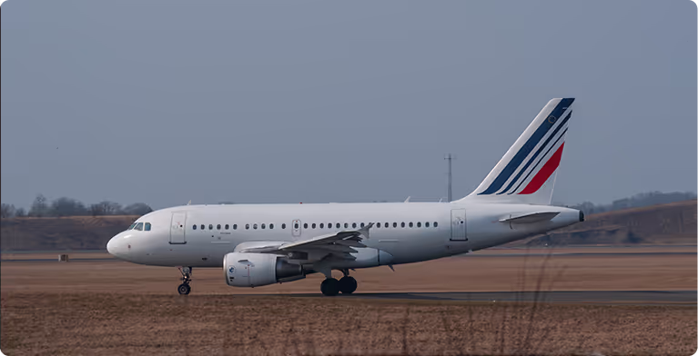 A large jetliner sitting on top of an airport runway.