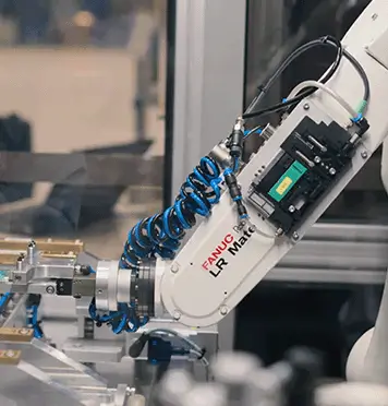 Industrial robotic arm featured in a facility tour video produced by Graphrs