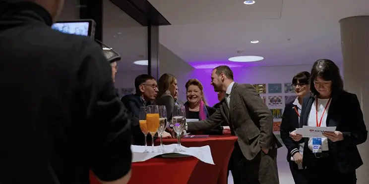 Graphrs team capturing key moments during a professional networking event recap video