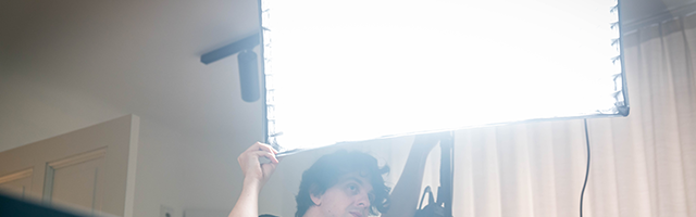 Graphrs videography team in Munich setting up a studio with lighting, camera, and editing equipment