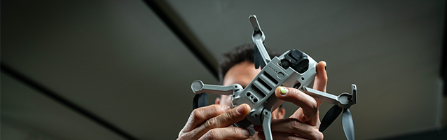 Close-up of hands operating a drone for a video shoot in Munich