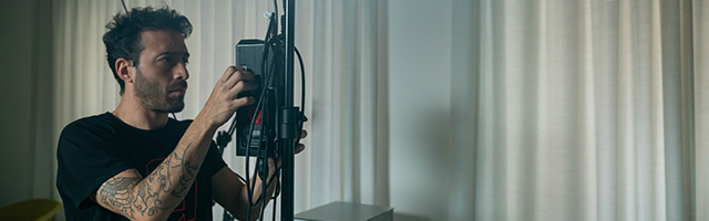 Video production team in a professional studio setup in Munich preparing a shoot under soft lighting