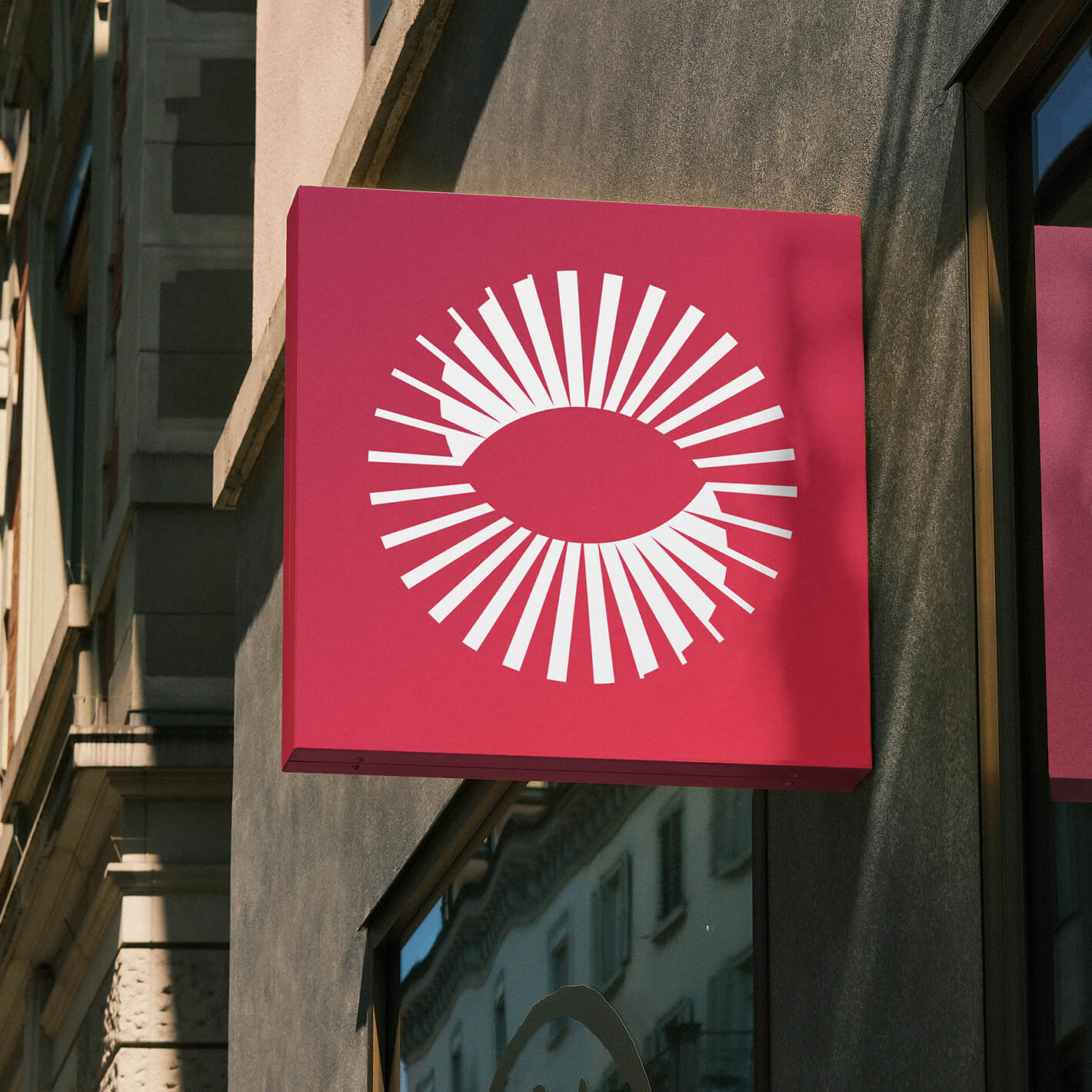 Het beeldmerk van Rojo op een uithangbord.