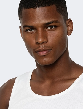 Headshot of Michael, a Botika created black male AI fashion model wearing a white tank top. 
