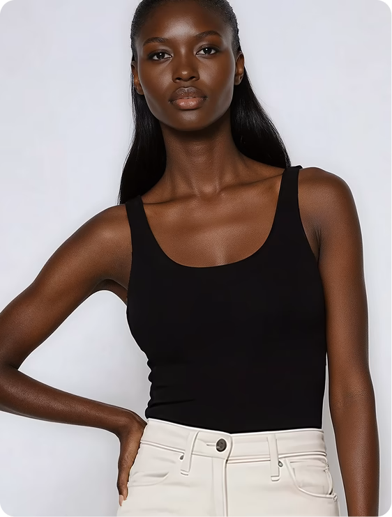 Headshot of a black female AI fashion model wearing a black tank top and white jeans. 
