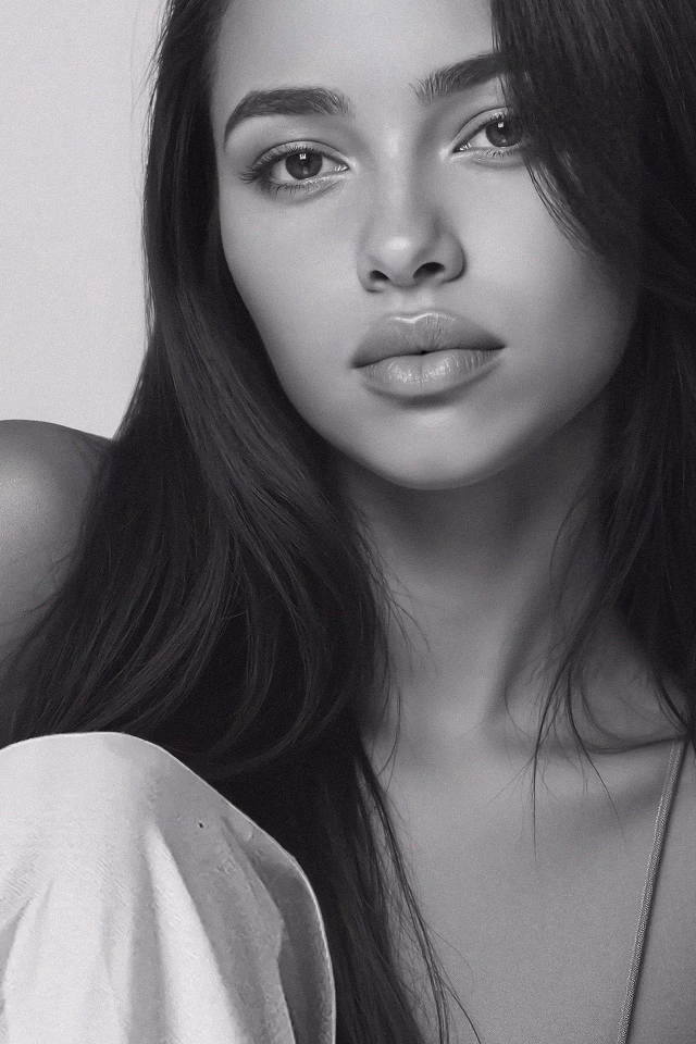 Black and white headshot of Camila a Latina AI fashion model wearing a strappy tank top.