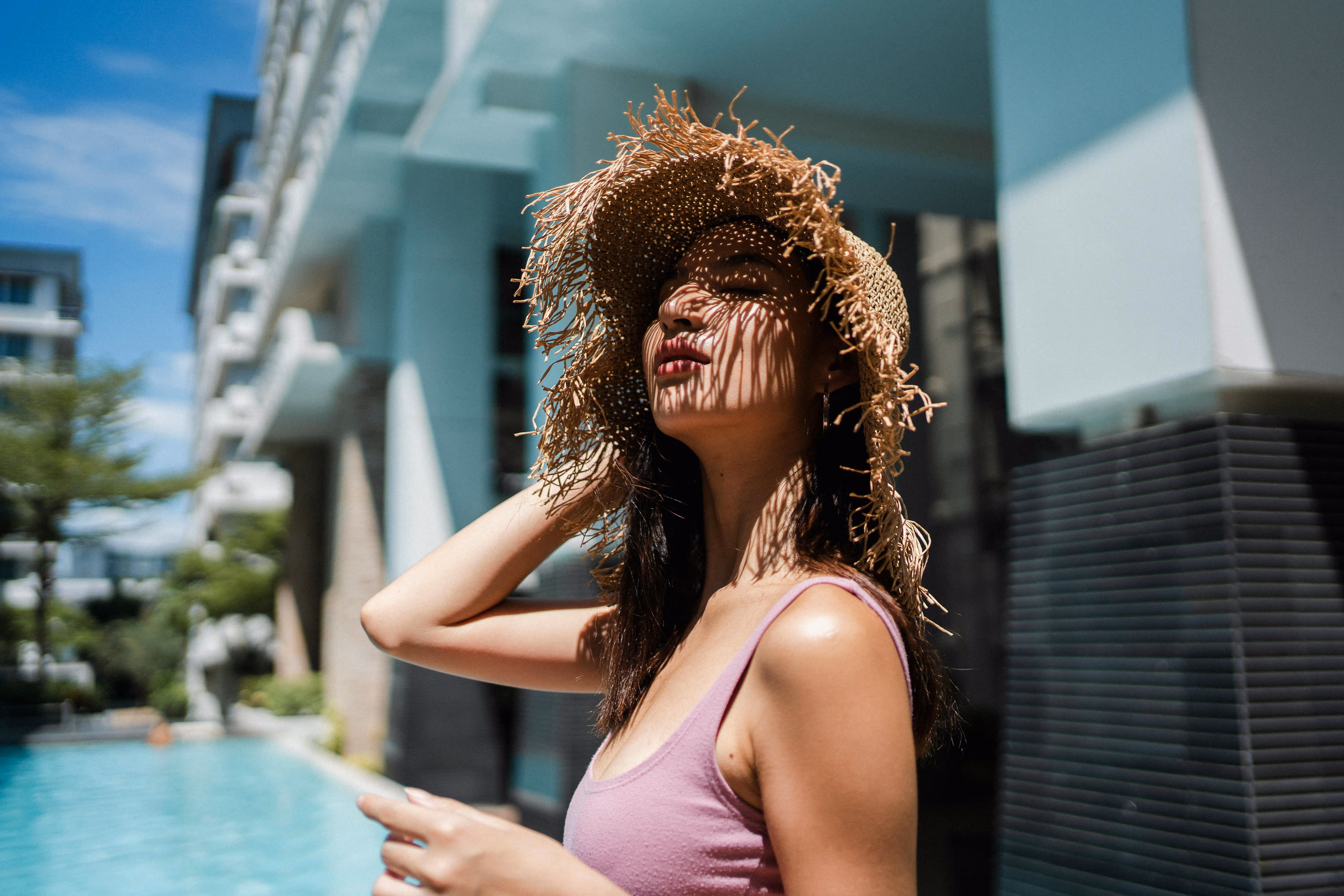 Woman at pool with image