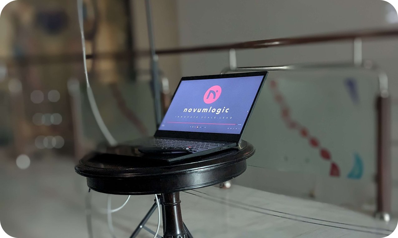 NovumLogic Technologies laptop display showing Innovate Scale Lead - AI and software development company Vadodara India