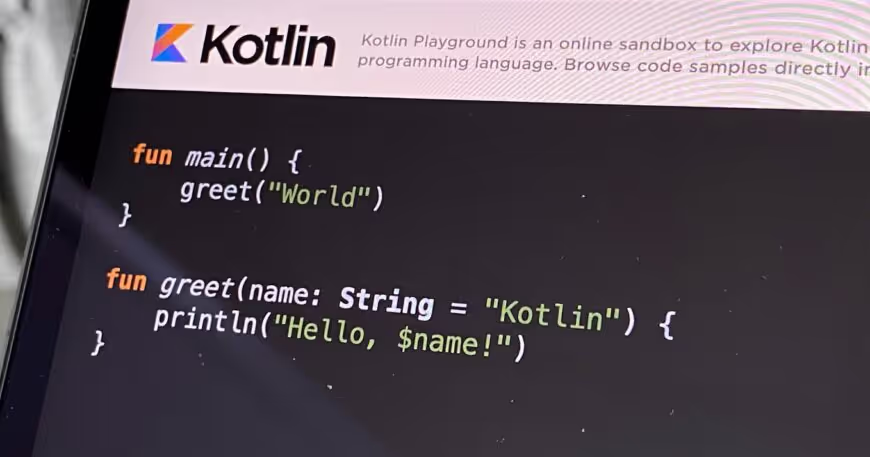 Screenshot of Kotlin code showcasing a simple main function and a greet function that prints "Hello, Kotlin!" or "Hello, World!"
