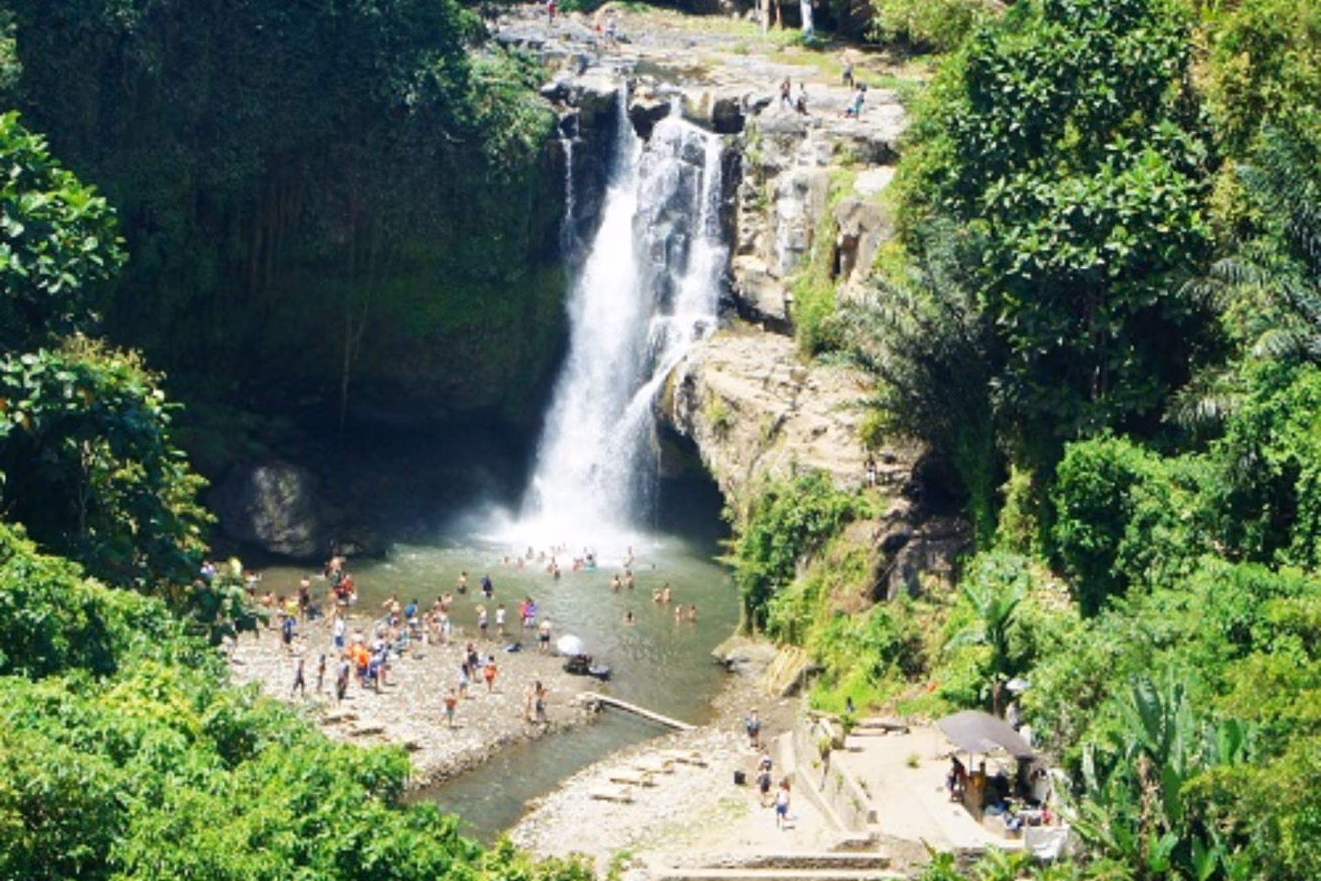 Tourists enjoying at Tegenungan Waterfall