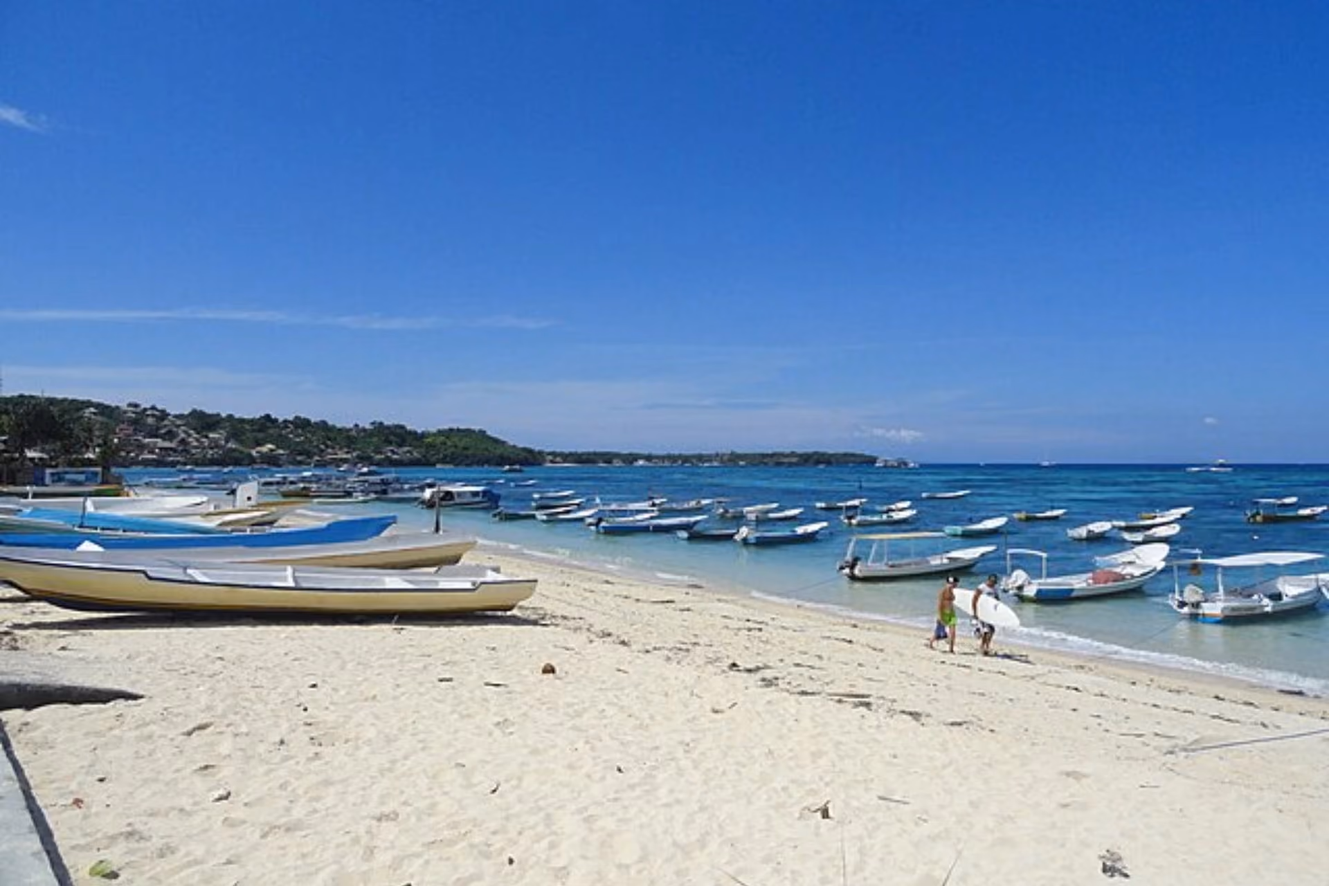 Boats are scattered along the Jungut Batu Beach.