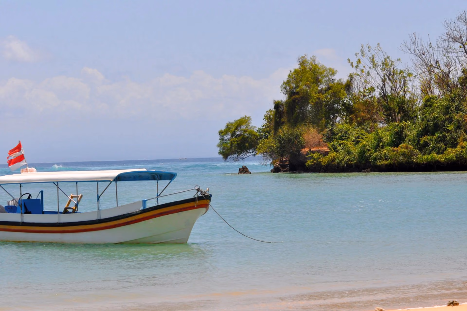 Boat anchored on the Geger Beach in Nusa Dua, Bali.