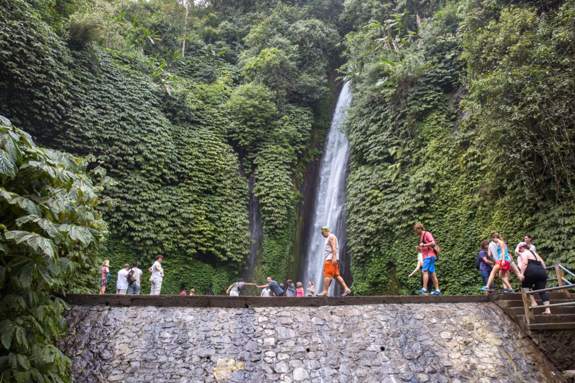 Tourists visiting Munduk Waterfall