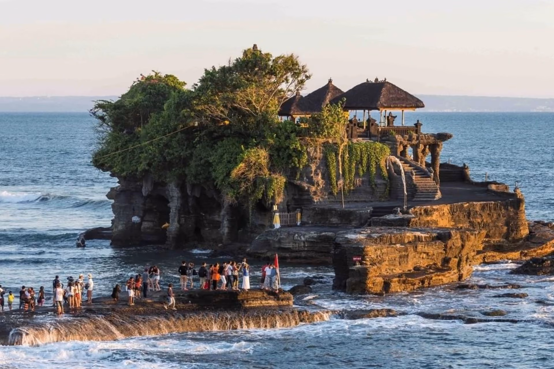 Tanah Lot Temple perched on a rocky coastline.