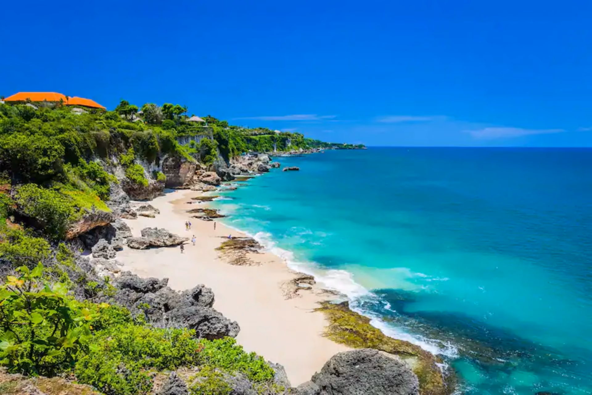 Aerial view of Jimbaran Beach with turquoise water. 